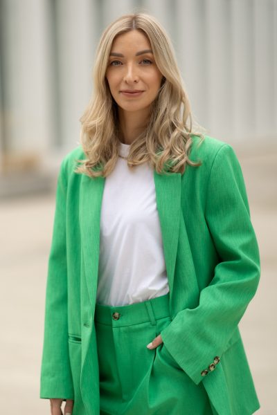 Woman in a green suit