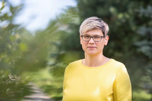 Woman in yellow jumper